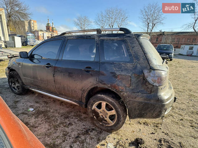 Черный Мицубиси Аутлендер, объемом двигателя 2 л и пробегом 258 тыс. км за 2200 $, фото 12 на Automoto.ua