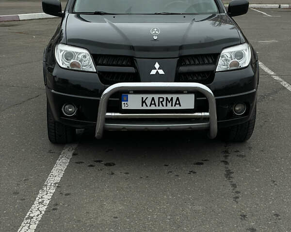 Чорний Міцубісі Аутлендер, об'ємом двигуна 2.38 л та пробігом 198 тис. км за 7100 $, фото 7 на Automoto.ua