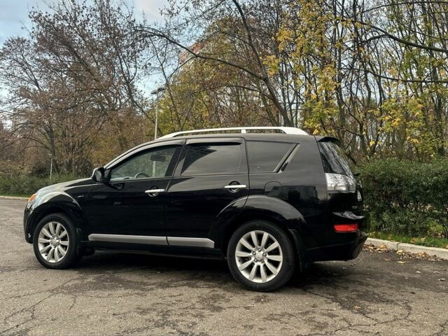 Черный Мицубиси Аутлендер, объемом двигателя 2.4 л и пробегом 230 тыс. км за 8500 $, фото 5 на Automoto.ua