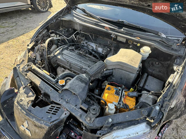 Черный Мицубиси Аутлендер, объемом двигателя 2 л и пробегом 258 тыс. км за 2200 $, фото 23 на Automoto.ua