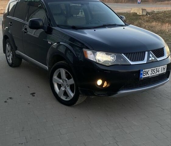 Чорний Міцубісі Аутлендер, об'ємом двигуна 2.4 л та пробігом 200 тис. км за 8300 $, фото 1 на Automoto.ua