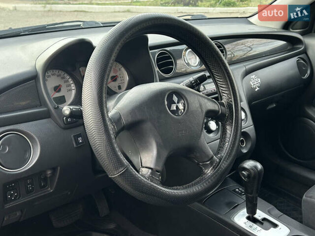 Черный Мицубиси Аутлендер, объемом двигателя 2.4 л и пробегом 320 тыс. км за 5999 $, фото 7 на Automoto.ua