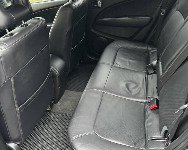 Чорний Міцубісі Аутлендер, об'ємом двигуна 2.4 л та пробігом 169 тис. км за 8000 $, фото 11 на Automoto.ua