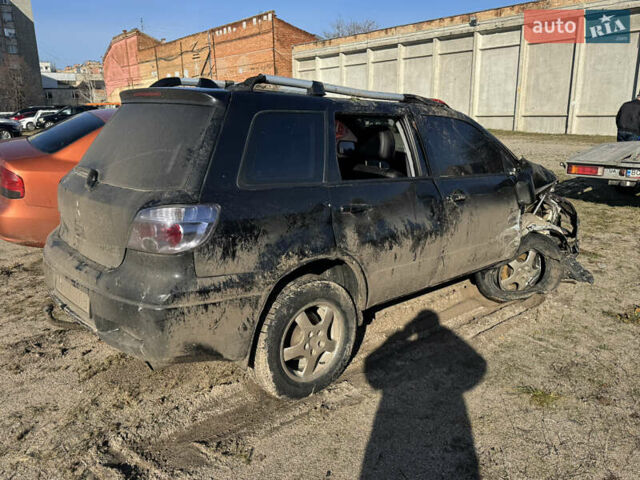 Черный Мицубиси Аутлендер, объемом двигателя 2 л и пробегом 258 тыс. км за 2200 $, фото 3 на Automoto.ua