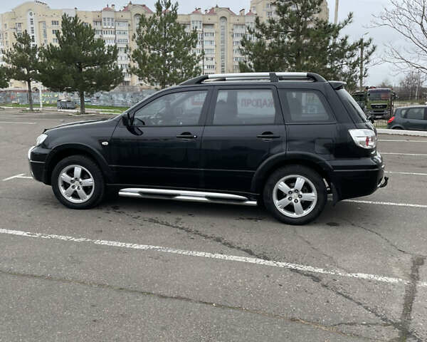 Чорний Міцубісі Аутлендер, об'ємом двигуна 2.38 л та пробігом 198 тис. км за 7100 $, фото 4 на Automoto.ua