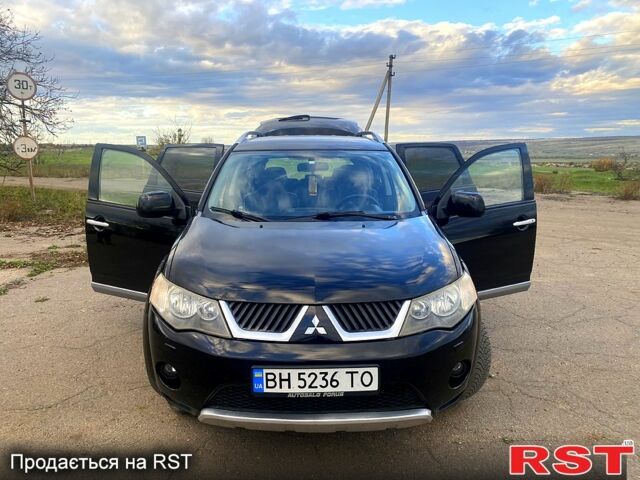 Черный Мицубиси Аутлендер, объемом двигателя 2 л и пробегом 207 тыс. км за 8100 $, фото 5 на Automoto.ua