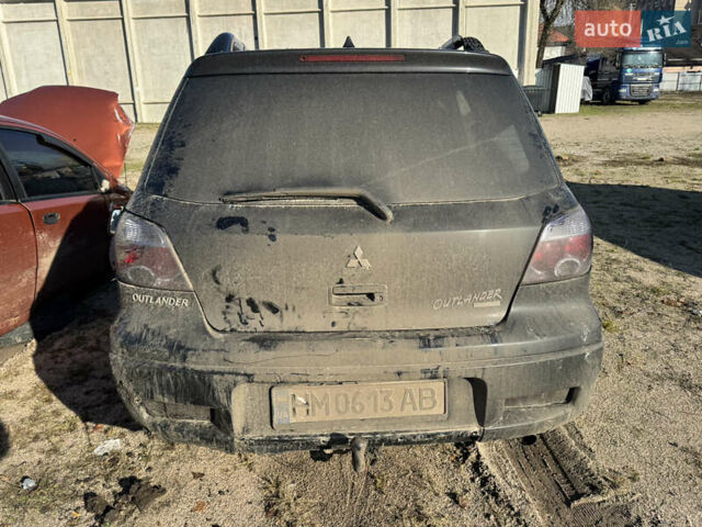 Черный Мицубиси Аутлендер, объемом двигателя 2 л и пробегом 258 тыс. км за 2200 $, фото 4 на Automoto.ua