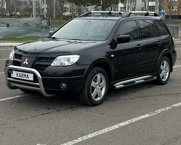Чорний Міцубісі Аутлендер, об'ємом двигуна 2.38 л та пробігом 198 тис. км за 7100 $, фото 5 на Automoto.ua