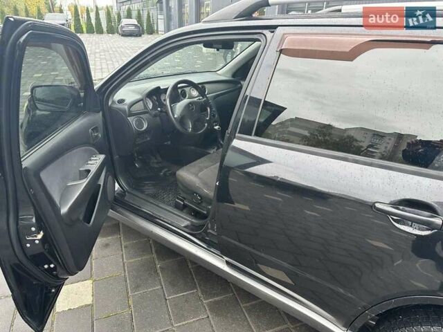 Черный Мицубиси Аутлендер, объемом двигателя 2 л и пробегом 295 тыс. км за 5300 $, фото 7 на Automoto.ua