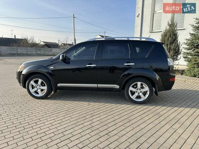 Черный Мицубиси Аутлендер, объемом двигателя 2.4 л и пробегом 234 тыс. км за 7400 $, фото 2 на Automoto.ua