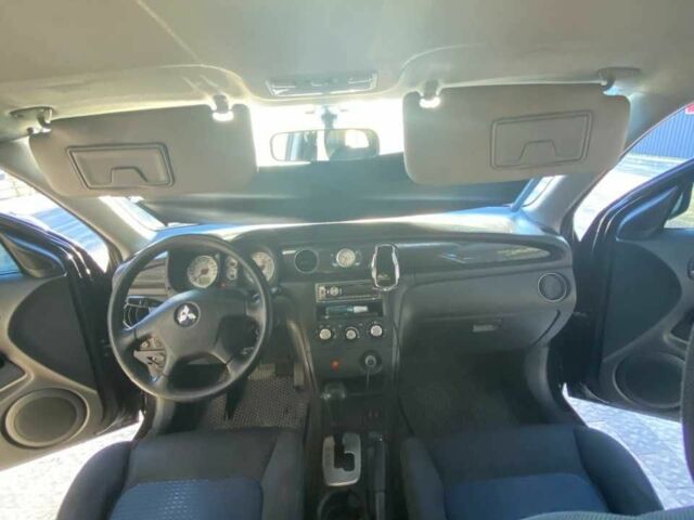 Черный Мицубиси Аутлендер, объемом двигателя 2.4 л и пробегом 219 тыс. км за 6500 $, фото 6 на Automoto.ua