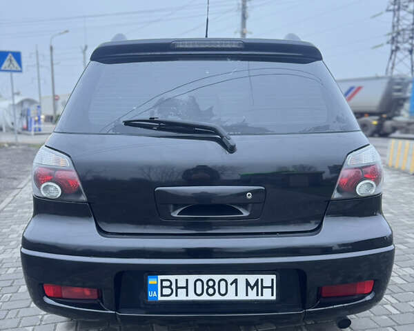 Чорний Міцубісі Аутлендер, об'ємом двигуна 2.38 л та пробігом 202 тис. км за 5800 $, фото 9 на Automoto.ua