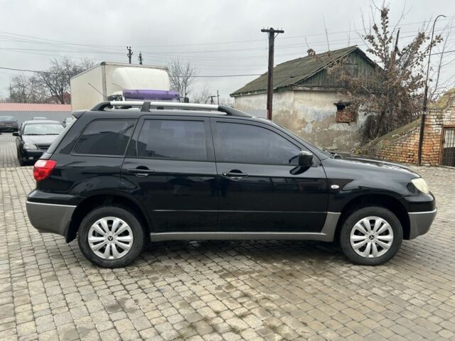 Чорний Міцубісі Аутлендер, об'ємом двигуна 2 л та пробігом 220 тис. км за 6299 $, фото 7 на Automoto.ua