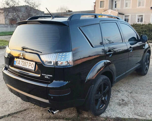Черный Мицубиси Аутлендер, объемом двигателя 3 л и пробегом 225 тыс. км за 9200 $, фото 4 на Automoto.ua