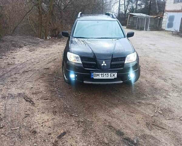 Черный Мицубиси Аутлендер, объемом двигателя 2 л и пробегом 235 тыс. км за 7350 $, фото 6 на Automoto.ua