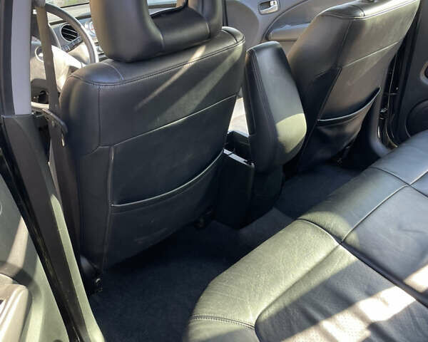 Черный Мицубиси Аутлендер, объемом двигателя 2.38 л и пробегом 118 тыс. км за 6850 $, фото 9 на Automoto.ua