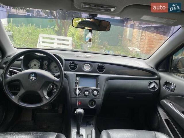 Чорний Міцубісі Аутлендер, об'ємом двигуна 2.38 л та пробігом 274 тис. км за 6500 $, фото 4 на Automoto.ua
