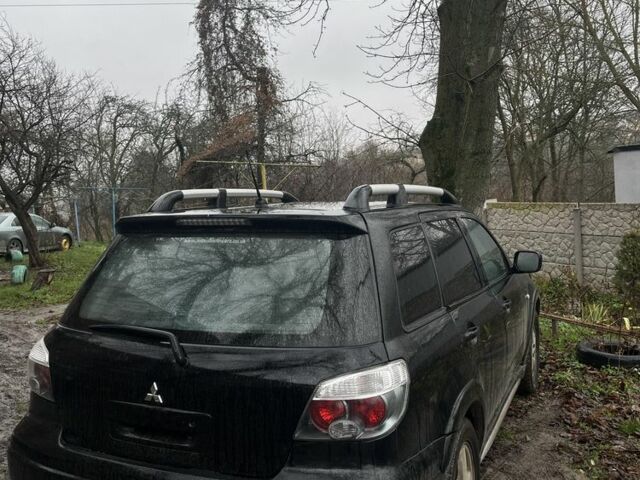 Черный Мицубиси Аутлендер, объемом двигателя 2 л и пробегом 430 тыс. км за 4300 $, фото 2 на Automoto.ua