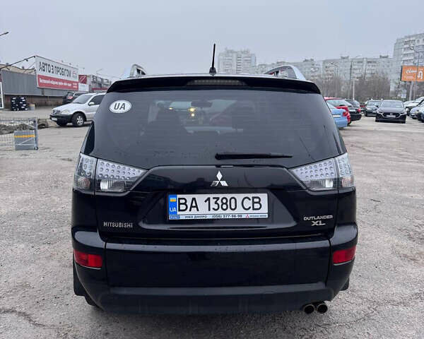 Черный Мицубиси Аутлендер, объемом двигателя 3 л и пробегом 202 тыс. км за 9999 $, фото 4 на Automoto.ua
