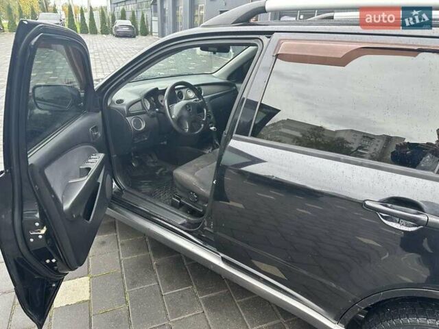 Черный Мицубиси Аутлендер, объемом двигателя 2 л и пробегом 295 тыс. км за 5300 $, фото 5 на Automoto.ua