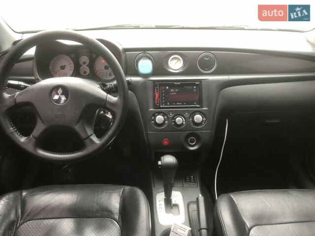 Черный Мицубиси Аутлендер, объемом двигателя 2.38 л и пробегом 314 тыс. км за 5000 $, фото 9 на Automoto.ua