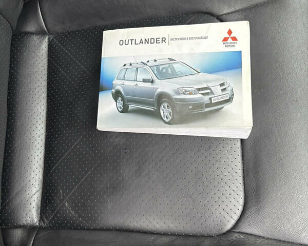 Чорний Міцубісі Аутлендер, об'ємом двигуна 2.4 л та пробігом 169 тис. км за 8000 $, фото 18 на Automoto.ua