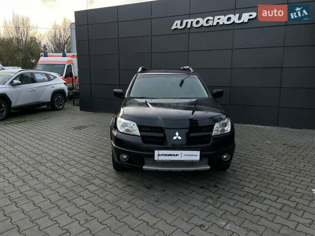 Черный Мицубиси Аутлендер, объемом двигателя 2.4 л и пробегом 248 тыс. км за 7300 $, фото 2 на Automoto.ua