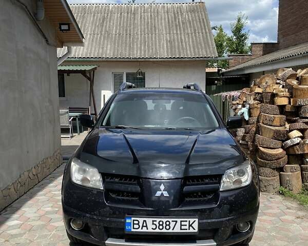 Чорний Міцубісі Аутлендер, об'ємом двигуна 2.38 л та пробігом 274 тис. км за 6500 $, фото 1 на Automoto.ua