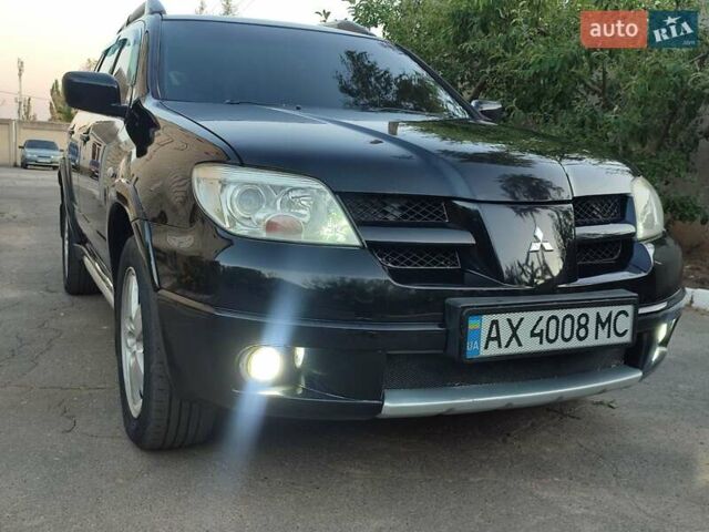 Чорний Міцубісі Аутлендер, об'ємом двигуна 2.38 л та пробігом 285 тис. км за 6700 $, фото 10 на Automoto.ua