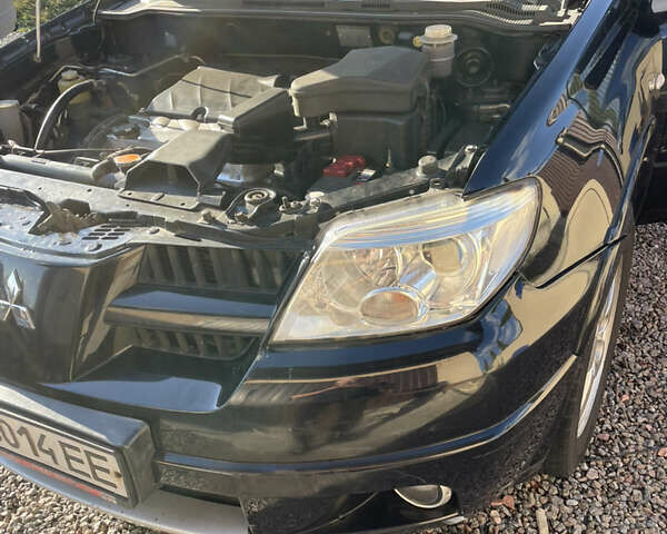 Черный Мицубиси Аутлендер, объемом двигателя 2.38 л и пробегом 118 тыс. км за 6850 $, фото 13 на Automoto.ua