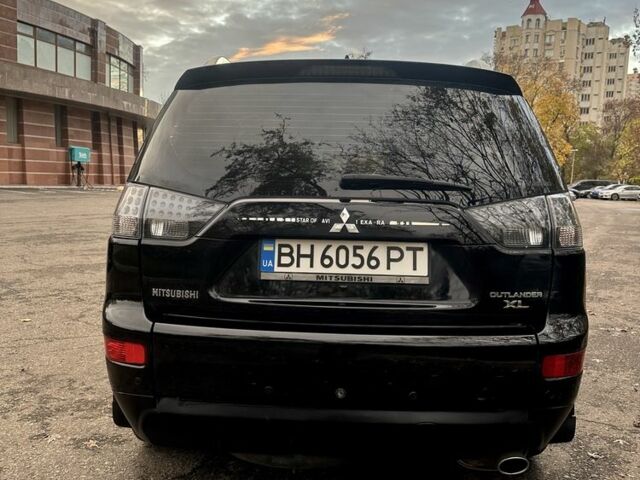 Черный Мицубиси Аутлендер, объемом двигателя 2.4 л и пробегом 230 тыс. км за 8500 $, фото 6 на Automoto.ua