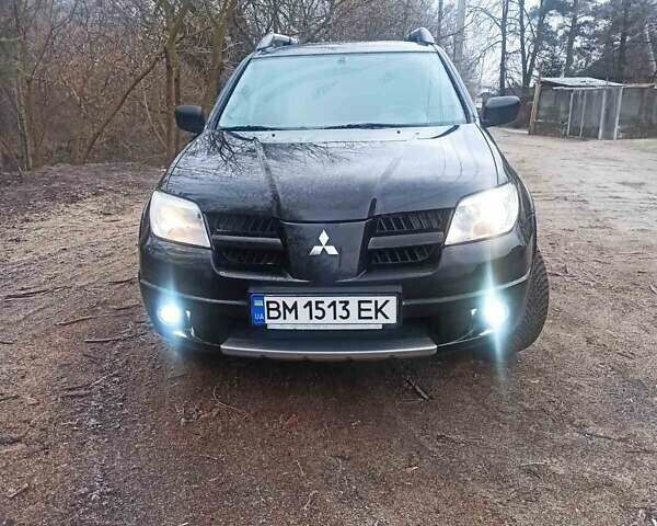 Черный Мицубиси Аутлендер, объемом двигателя 2 л и пробегом 235 тыс. км за 7350 $, фото 7 на Automoto.ua