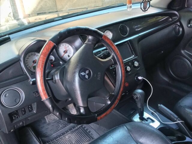 Черный Мицубиси Аутлендер, объемом двигателя 2.4 л и пробегом 248 тыс. км за 7000 $, фото 10 на Automoto.ua