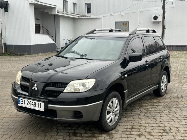 Чорний Міцубісі Аутлендер, об'ємом двигуна 2 л та пробігом 220 тис. км за 6299 $, фото 1 на Automoto.ua