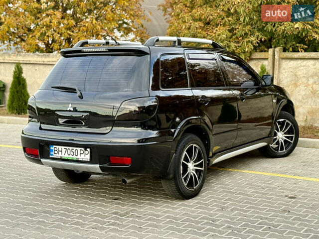 Міцубісі Аутлендер 2007 у Одесі на Automoto.ua Чорний Міцубісі Аутлендер, об'ємом двигуна 2.4 л та пробігом 201 тис. км за 7700 $, фото 7 на Automoto.ua