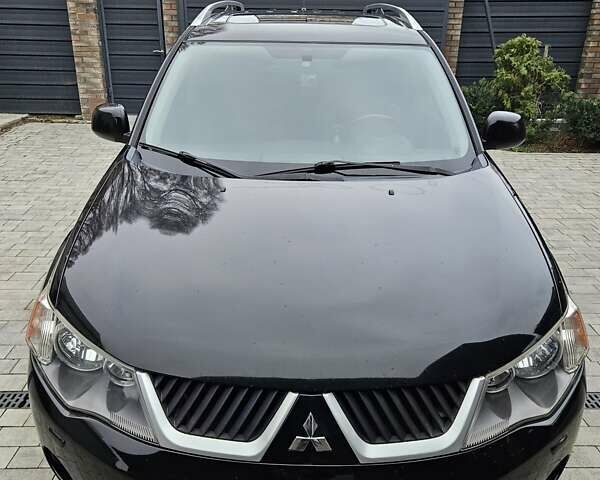 Черный Мицубиси Аутлендер, объемом двигателя 3 л и пробегом 238 тыс. км за 10800 $, фото 2 на Automoto.ua