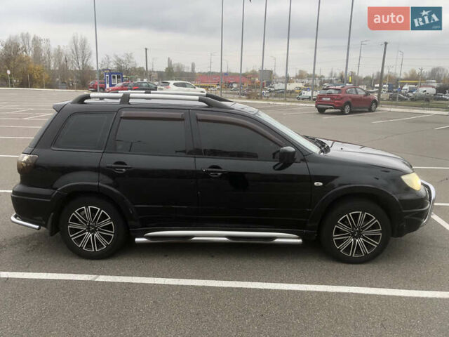 Черный Мицубиси Аутлендер, объемом двигателя 2.38 л и пробегом 314 тыс. км за 5000 $, фото 1 на Automoto.ua