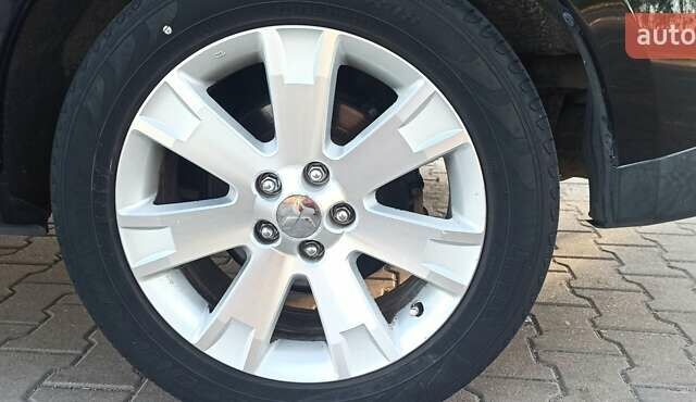 Черный Мицубиси Аутлендер, объемом двигателя 1.97 л и пробегом 244 тыс. км за 9000 $, фото 18 на Automoto.ua