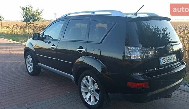 Черный Мицубиси Аутлендер, объемом двигателя 1.97 л и пробегом 244 тыс. км за 9000 $, фото 2 на Automoto.ua