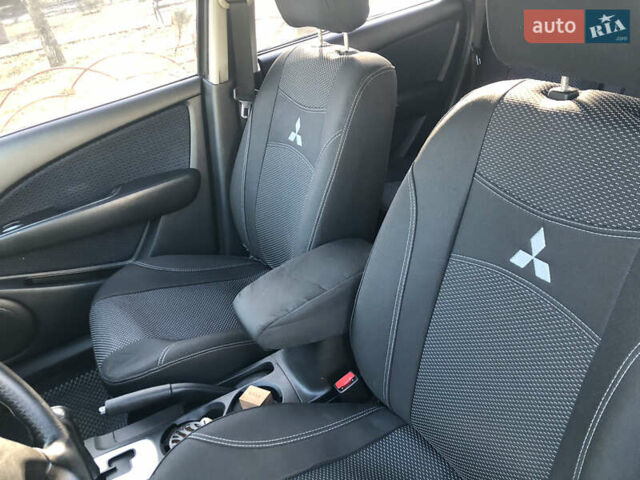 Черный Мицубиси Аутлендер, объемом двигателя 2.4 л и пробегом 260 тыс. км за 7200 $, фото 17 на Automoto.ua