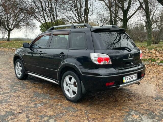 Черный Мицубиси Аутлендер, объемом двигателя 2.4 л и пробегом 213 тыс. км за 6850 $, фото 8 на Automoto.ua