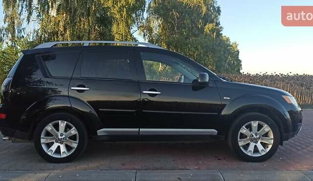 Черный Мицубиси Аутлендер, объемом двигателя 1.97 л и пробегом 244 тыс. км за 9000 $, фото 5 на Automoto.ua
