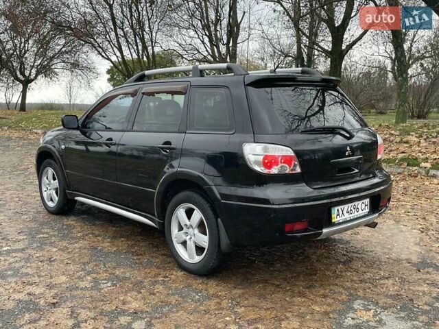 Чорний Міцубісі Аутлендер, об'ємом двигуна 2.4 л та пробігом 213 тис. км за 6850 $, фото 8 на Automoto.ua