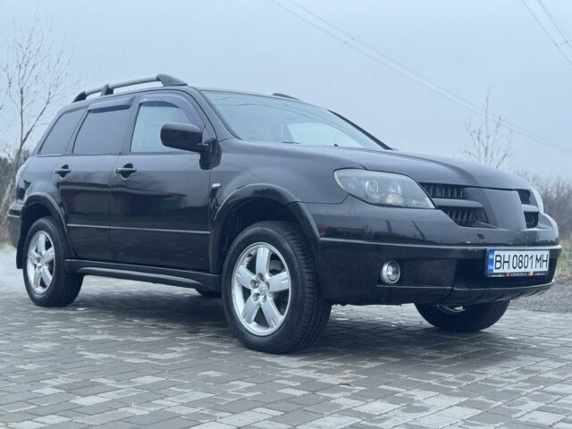 Чорний Міцубісі Аутлендер, об'ємом двигуна 2.4 л та пробігом 202 тис. км за 5800 $, фото 3 на Automoto.ua