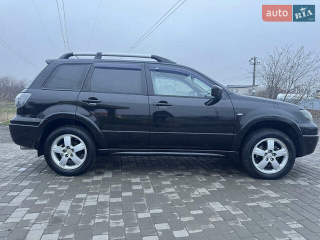 Чорний Міцубісі Аутлендер, об'ємом двигуна 2.38 л та пробігом 202 тис. км за 5800 $, фото 11 на Automoto.ua
