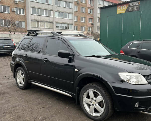 Чорний Міцубісі Аутлендер, об'ємом двигуна 2 л та пробігом 172 тис. км за 7500 $, фото 3 на Automoto.ua