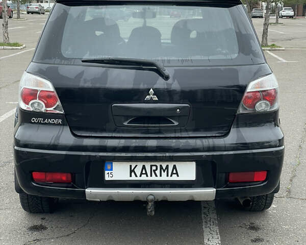 Чорний Міцубісі Аутлендер, об'ємом двигуна 2.38 л та пробігом 198 тис. км за 7100 $, фото 3 на Automoto.ua