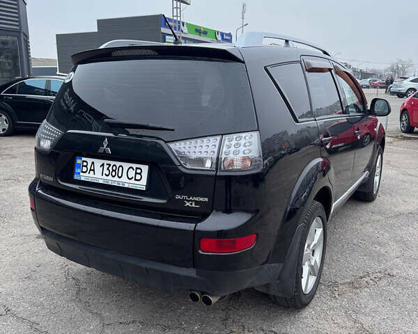 Черный Мицубиси Аутлендер, объемом двигателя 3 л и пробегом 202 тыс. км за 9999 $, фото 6 на Automoto.ua