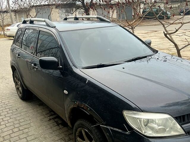 Чорний Міцубісі Аутлендер, об'ємом двигуна 2.4 л та пробігом 267 тис. км за 6000 $, фото 1 на Automoto.ua