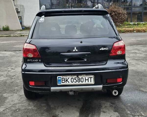 Чорний Міцубісі Аутлендер, об'ємом двигуна 2 л та пробігом 200 тис. км за 4700 $, фото 12 на Automoto.ua